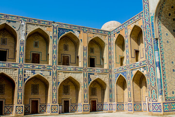 Uzbekistan architecture in Samarkand and Bukhara with intricate mosaics blue domes ancient madrasas Islamic patterns historic monuments vibrant tilework and cultural heritage in bright daylight