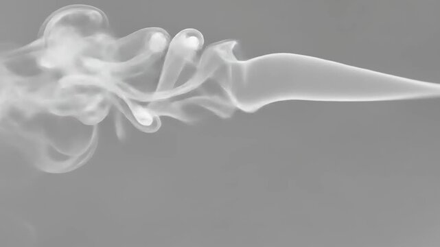 Wispy white vapor flowing horizontally against solid gray background