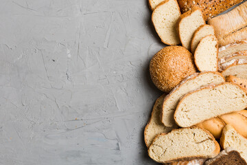 Homemade natural breads. Different kinds of fresh bread as background, top view with copy space