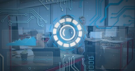 Interacting seated male in light button-down reaching toward circular HUD overlays in office