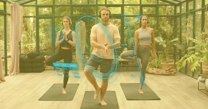 Balancing three adults practicing tree pose on black mats in greenhouse, wearing crop tops and AR