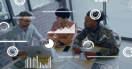 Reviewing business-casual team of three collaborating at modern office table, using laptop and HUD