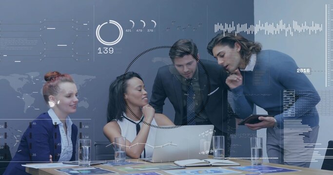 Analyzing data, four colleagues in suits leaning over laptop at meeting table, with HUD overlays