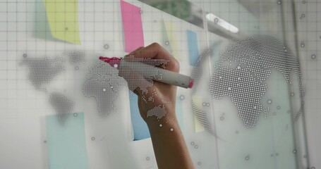 Writing right hand marking glass board at office, with pink marker, sticky notes, dotted map © vectorfusionart