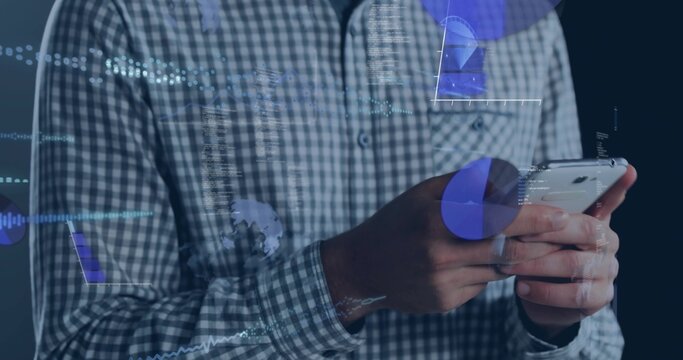 Tapping male hands in checkered shirt holding white smartphone with data overlays at studio - Powered by Adobe
