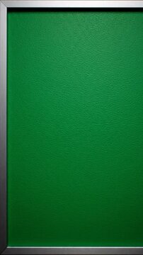 Close-up of a textured, green surface framed by a silver border