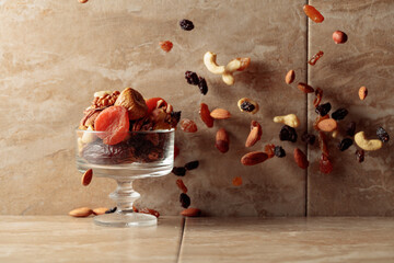 Mix of dried fruits and nuts in motion.