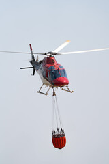 Helicopter Engaged in Aerial Firefighting Mission