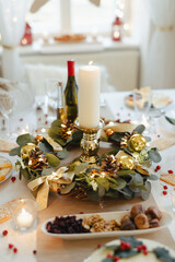 A table set for dinner meal at Christmas time.