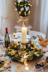 A table set for dinner meal at Christmas time.