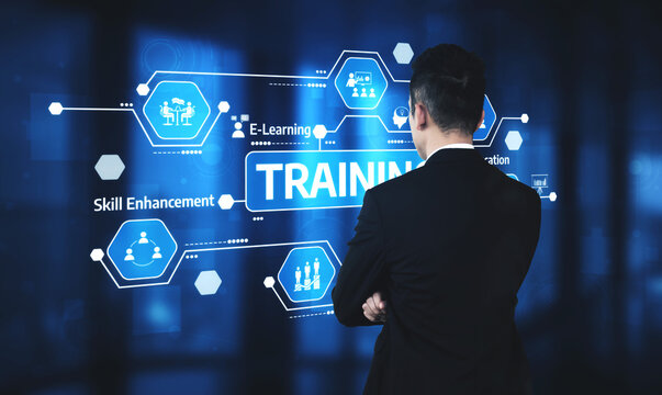 A business professional analyzes digital training concepts, highlighting the importance of skill enhancement and e-learning in a modern corporate setting. Tessel