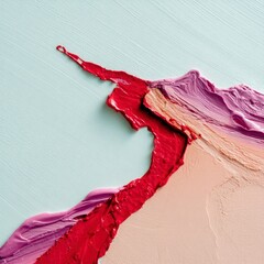 Close-up of vibrant paint strokes in red, pink, and peach colors on a light blue canvas. Abstract art with textured details.