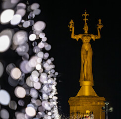 During the Christmas season, the pier leading to the famous Imperia statue in the harbour is adorned with sparkling Christmas lights. Constance, Baden-W&uuml;rttemberg, Germany.