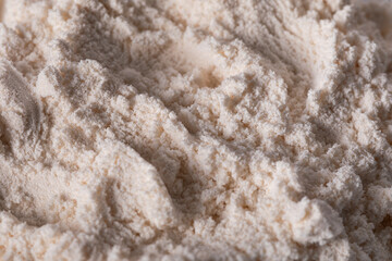 \nClose-up of zinc oxide (ZnO) powder showing its fine, soft texture and light color. Commonly used in cosmetics, pharmaceuticals, and industrial applications for its protective properties.