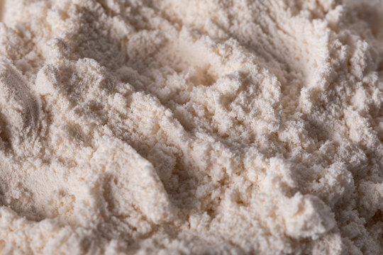 \nClose-up of zinc oxide (ZnO) powder showing its fine, soft texture and light color. Commonly used in cosmetics, pharmaceuticals, and industrial applications for its protective properties.