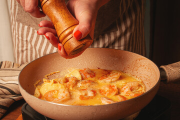 Preparing a delicious shrimp omelette in a cozy kitchen setting during a relaxing weekend morning