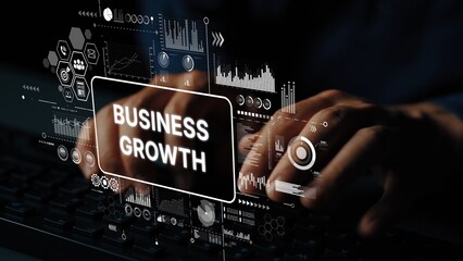 Hands Typing on Keyboard with Digital Overlay Representing Business Growth and Data Analysis Concepts in the Modern Workplace. Asymptotic smart data analytic.