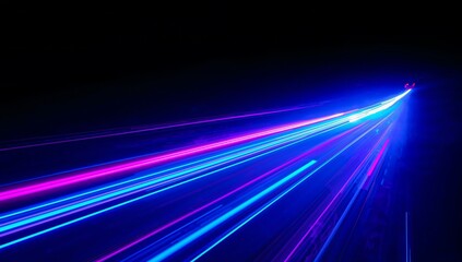 Abstract streaks of blue and pink light trails against a dark background