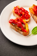Bruschetta roasted pepper vegetable dish natural product tasty snack fresh delicious gourmet food background on the table rustic top view copy space vegan and vegan food