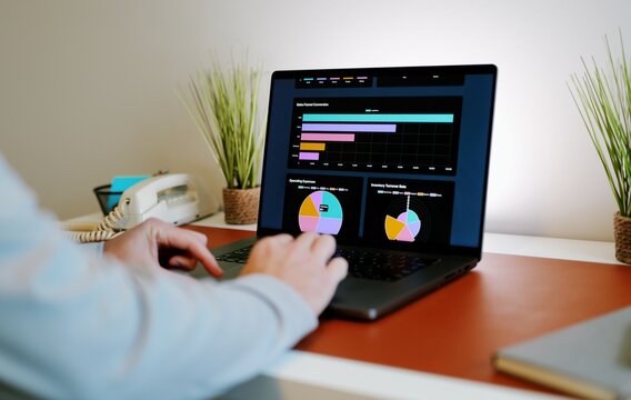 Business professional analyzing colorful sales funnel, ROI, inventory dashboards on laptop - Perfect for SaaS, analytics, fintech, data themes - Powered by Adobe