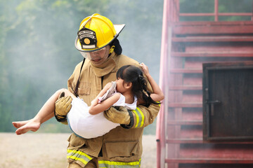 Firefighters rescuing a child from smoke-filled or burning building.