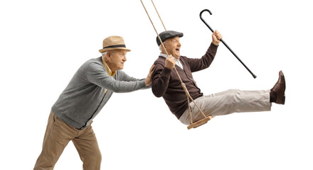 Whimsical senior men embrace joy on a swing, celebrating life with infectious laughter against