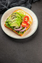 Avocado toast vegetable dish natural product tasty snack fresh delicious gourmet food background on the table rustic top view copy space keto and paleo diet vegan and vegan food
