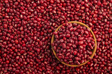 Close up Uncooked Azuki bean in wooden bowl.Japanese red beans with copy space.Top view.