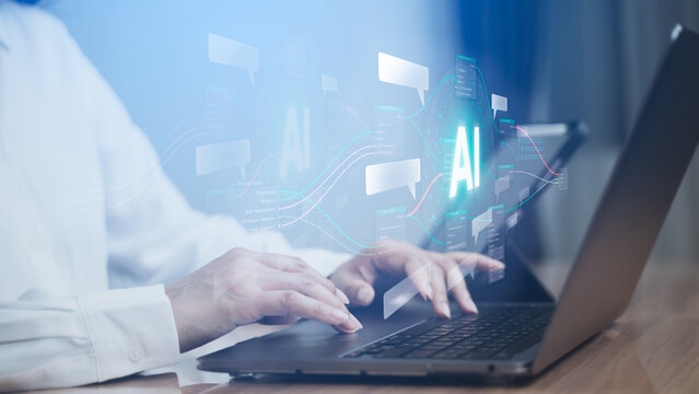 Hands typing on a laptop with glowing AI graphics, charts, and data visuals, representing artificial intelligence and analytics work.