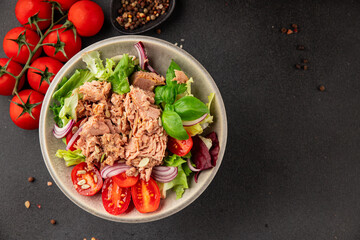 Tuna salad canned fish, tomato, green leaf salad vegetable dish natural product tasty snack fresh gourmet food backgroun drustic top view copy space keto and paleo vegetarian food pescetarian diet