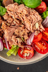 Tuna salad canned fish, tomato, green leaf salad vegetable dish natural product tasty snack fresh gourmet food backgroun drustic top view copy space keto and paleo vegetarian food pescetarian diet