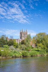 Fototapeta premium Hereford Cathedral viewed across the River Wye on Easter Sunday, Hereford, Herefordshire, England UK
