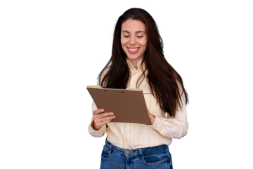 Professional woman smiling, reviewing business documents on a clipboard, standing and planning, transparent background