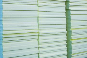Stacked insulation foam boards at construction site ready for building thermal insulation work
