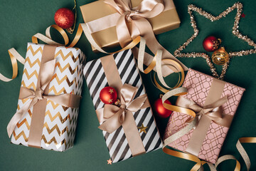 Festive Christmas new year 2026  background with  elegant wrapped gifts and golden decorations on a...