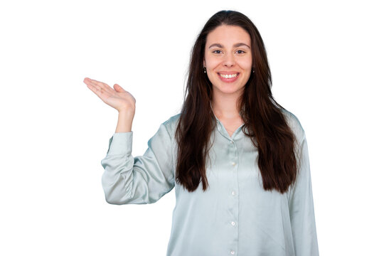 Young smiling woman presenting, showing and welcoming with open hand gesture, offering copy space