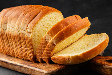Brioche bread slices bakery pastry natural product tasty snack fresh delicious gourmet food background on the table rustic top view copy space