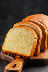 Brioche bread slices bakery pastry natural product tasty snack fresh delicious gourmet food background on the table rustic top view copy space