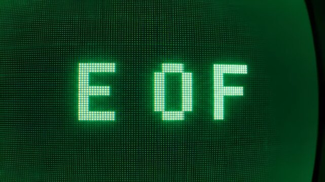 Retro Monitor Displays End of File Message in Green Typeface