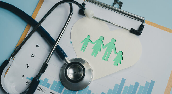 Family health concept with stethoscope and paper cutout of family on clipboard with chart data, symbolizing medical care and wellness for all ages