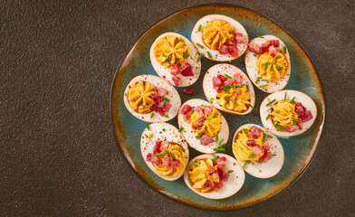 Spicy, stuffed ramen eggs, with bacon and green onions, homemade, no people,
