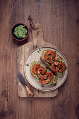 sandwiches with avocado and caramelized shrimp, micro-greens, breakfast, on a plate, top view, homemade, no people,