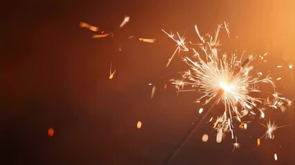 Bright sparkler burning on dark background. Bengal light with glowing sparks. Festive celebration concept for holiday card banner.