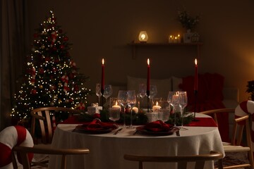 Festive table setting with Christmas decor indoors