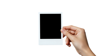 A hand holding a blank instant photo offering versatile design possibilities on transparent background.