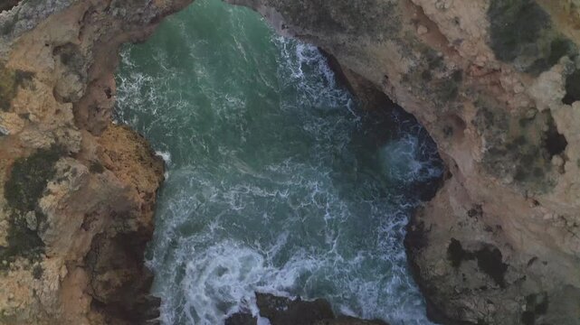 Amazing Aerial View of a Rocky Coastal Landscape with Sea Waves Crashing