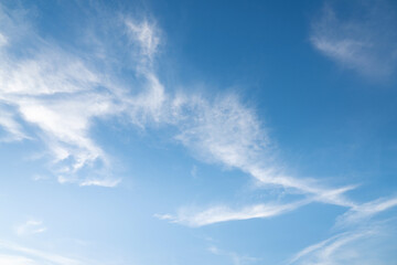 The sky is a vibrant, cloudless blue, while the sun shines brightly, making it appear even more radiant.