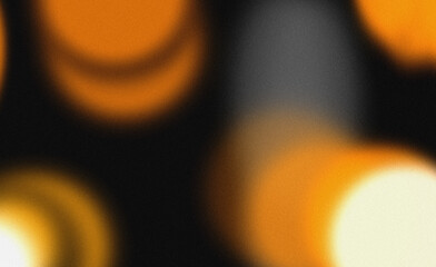 Abstract grainy texture with glowing orange bokeh