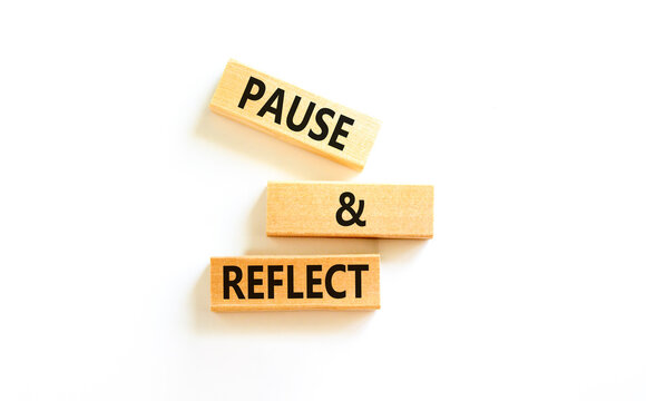 Pause and reflect symbol. Concept words Pause and reflect on beautiful block. Beautiful white table white background. Business motivational lifestyle pause and reflect concept. Copy space.