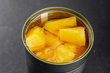 Pineapple canned chunks sweet fruit dessert tasty snack fresh delicious gourmet food background on the table rustic top view copy space keto and paleo diet vegetarian and vegan food